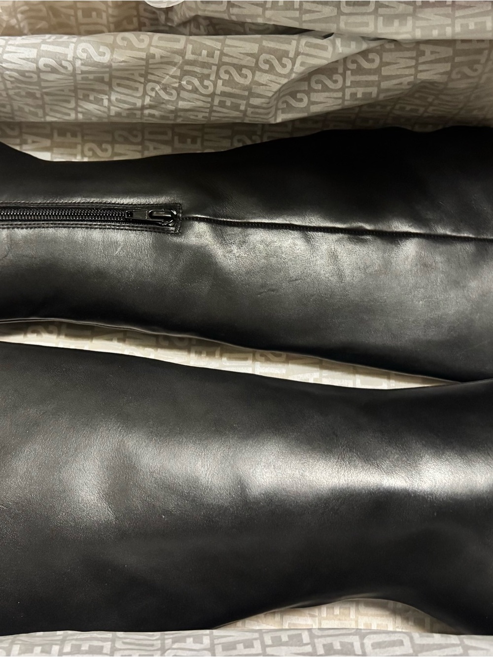 Knee high sleek square toe boot.